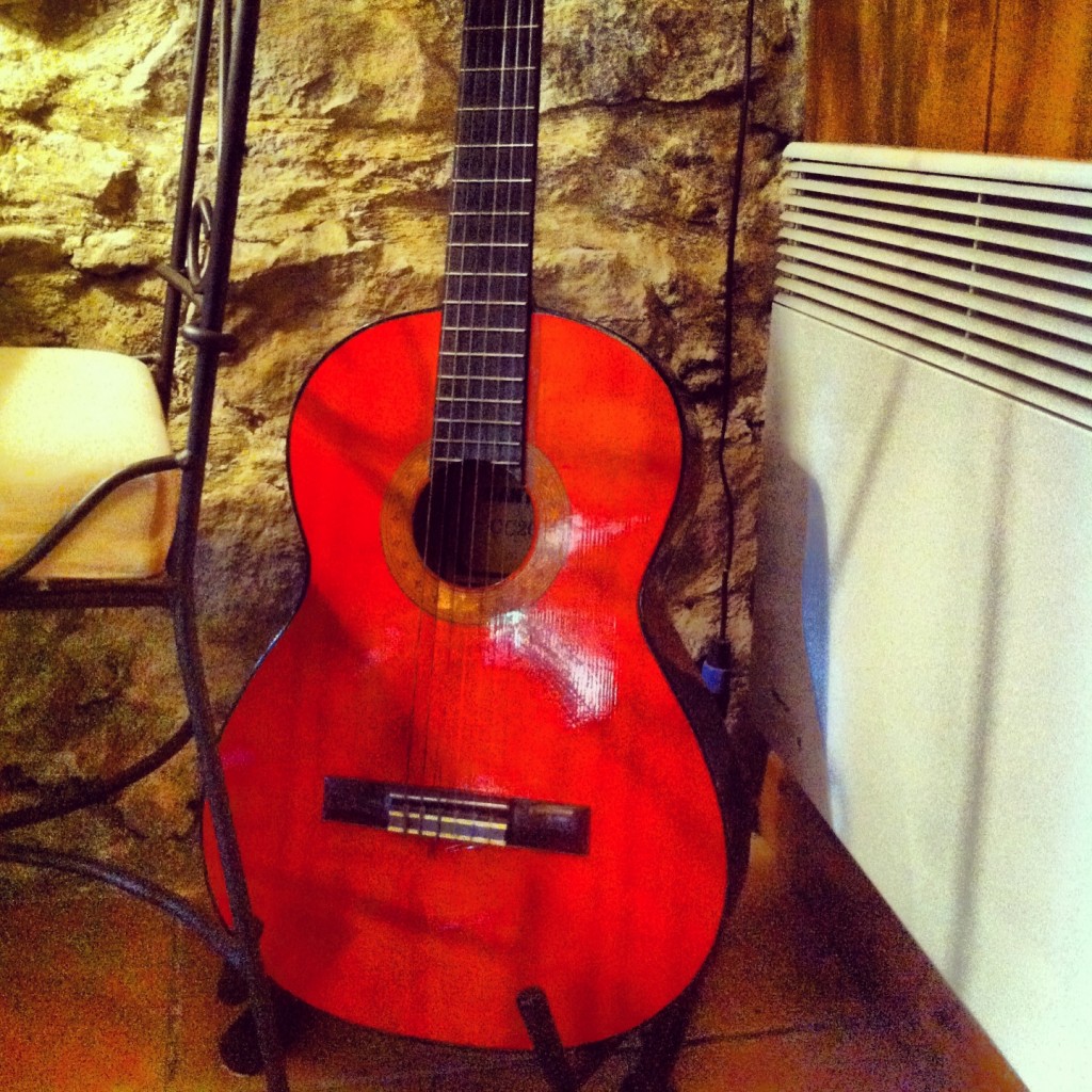 Red guitar in restaurant in Minerve, South of France