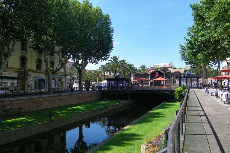 A view towards the end of Les Quais in Perpignan in the South of France