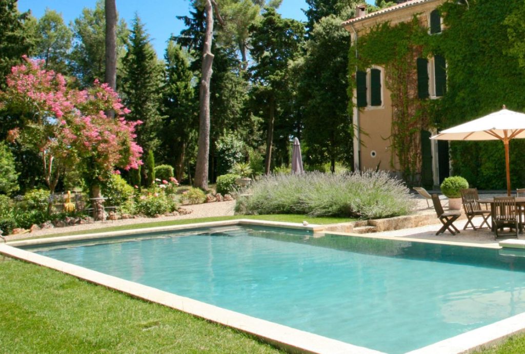 The view of the pool at Domaine Saint Hilarion   - a private villa for rent near Pezenas close to the route of the 2024 Tour de France