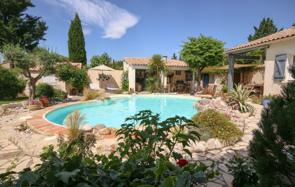 The pool and a modern Mediterranean holiday home in a quiet village with garden and grounds