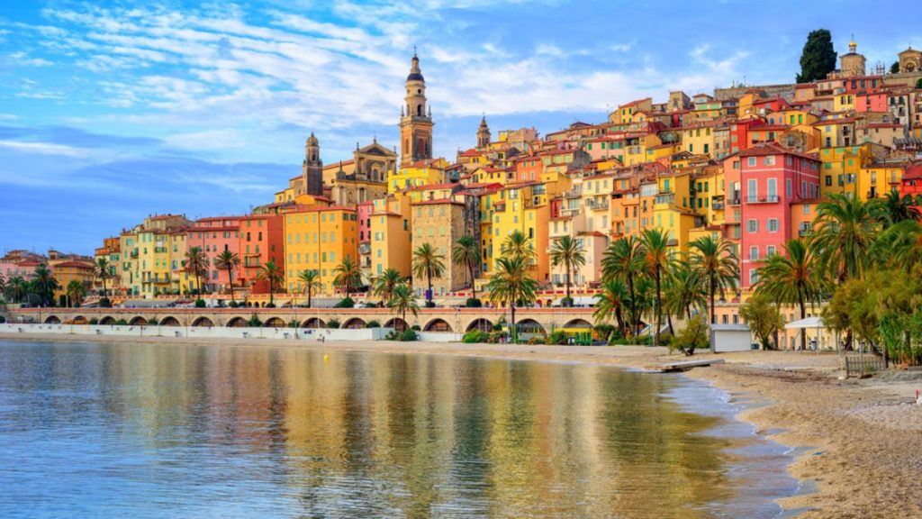 View over the Mediterranean to the colourful skyline of Menton