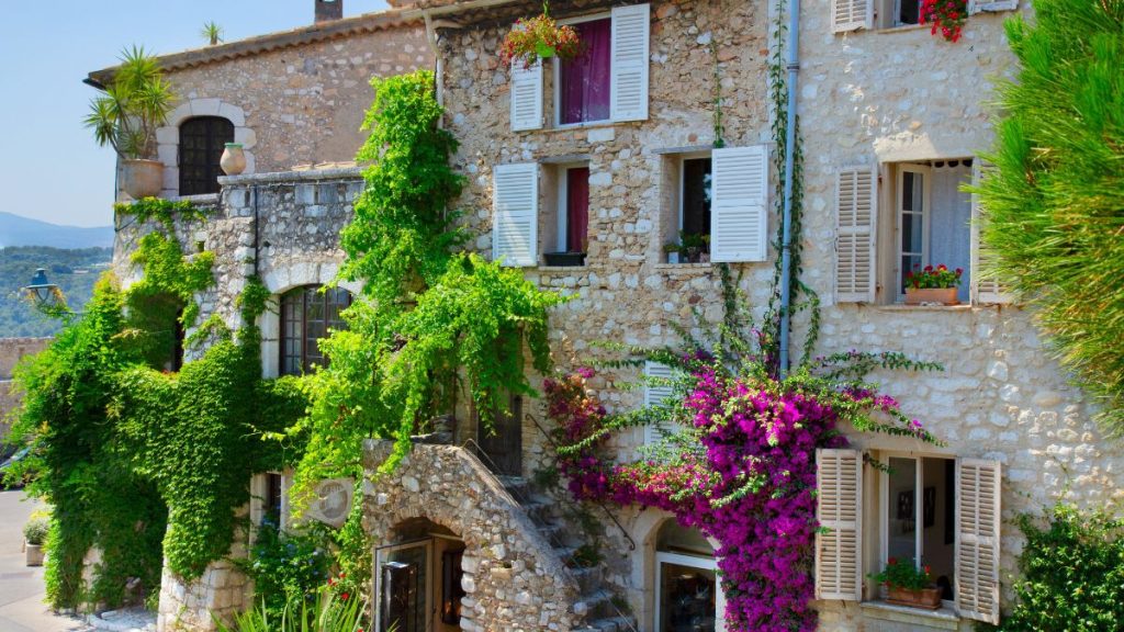Charming Provencal stone buildings with lush plants